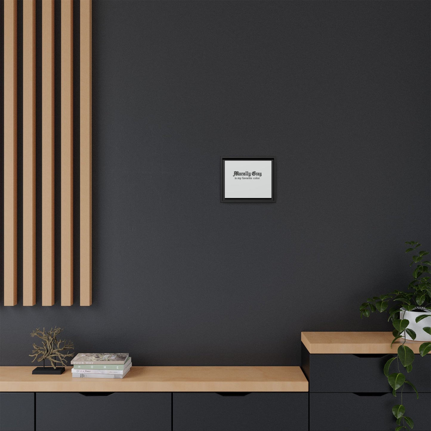 Minimalist modern interior with dark gray wall, light wood shelving and accents, small framed art, and green plant, featuring the Unknown Product.