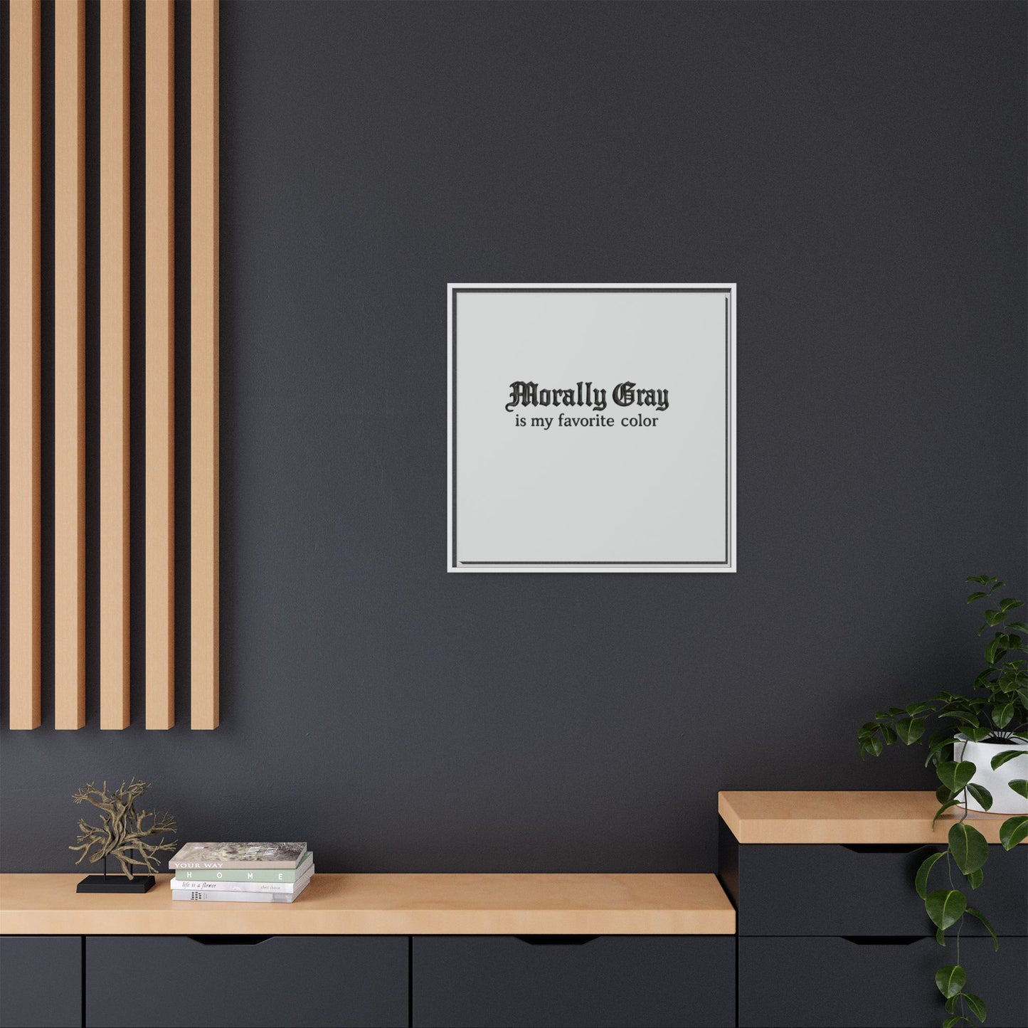 Minimalist wall art with the phrase "Morally Gray is my favorite color" in black gothic font on a white background, displayed in a modern living space featuring wood and black accents, representing the Unknown Product.