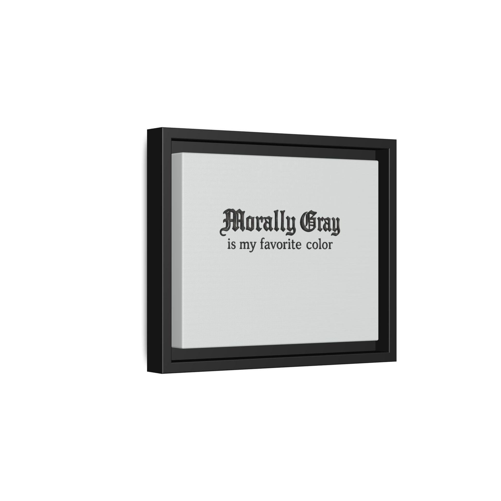 Framed wall art with black gothic text reading "Morally Gray is my favorite color" on a light gray background, featuring Unknown Product branding.
